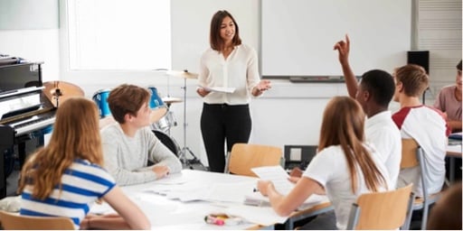 teacher-standing-in-front-of-class